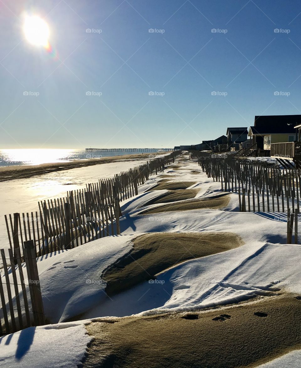 Snow covered sand dunes at Kill Devil Hills beach