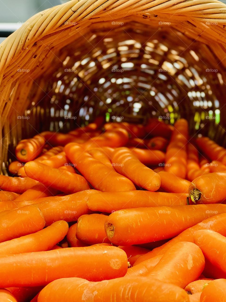 Bamboo basket full of carrots.