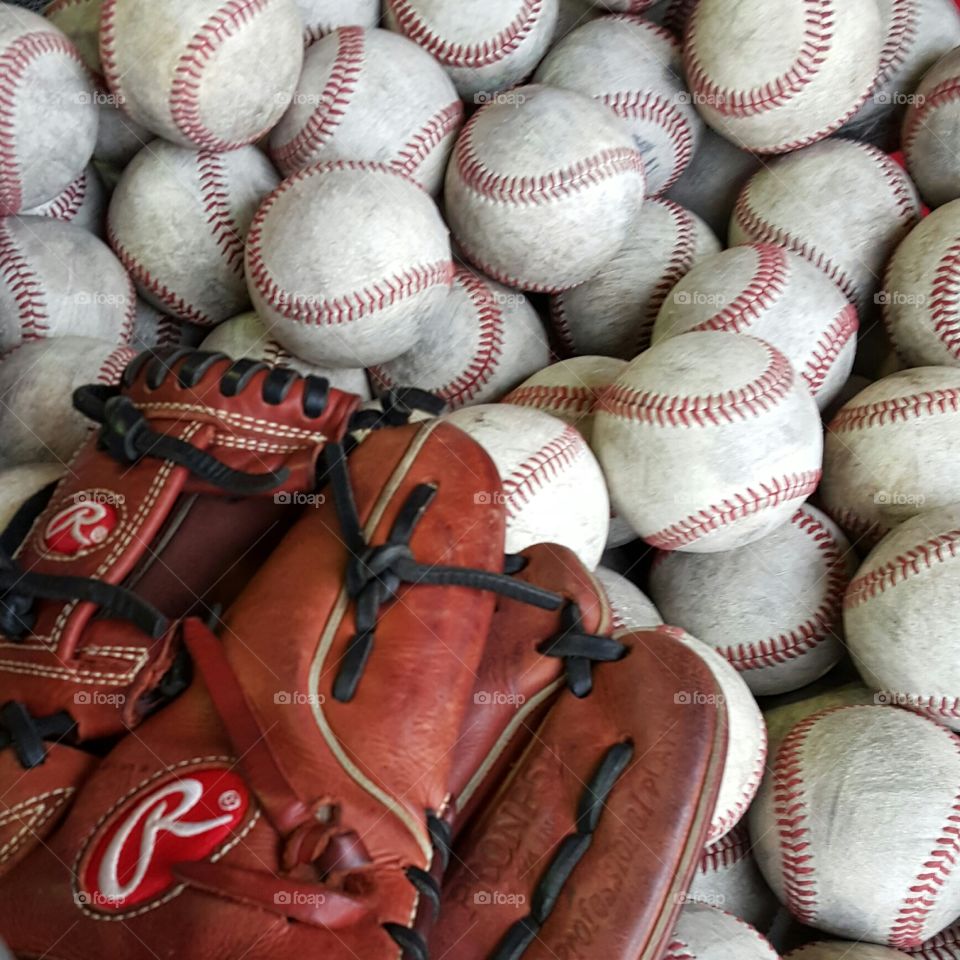 Glove and baseballs,   ready for the bullpen.