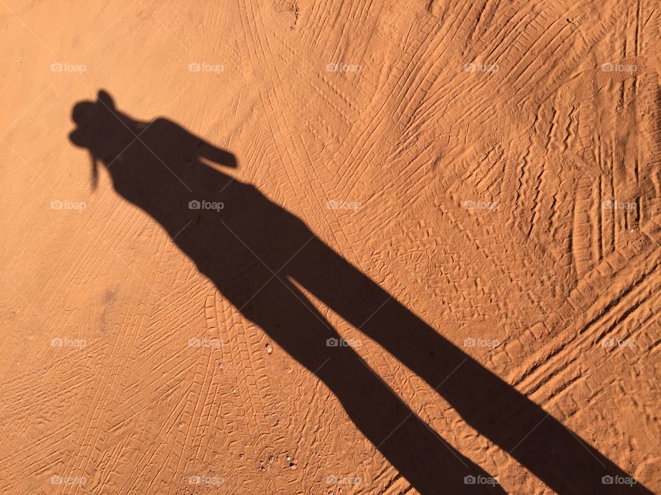 Shadow of a person on the red ground at the Monument valley,Utah