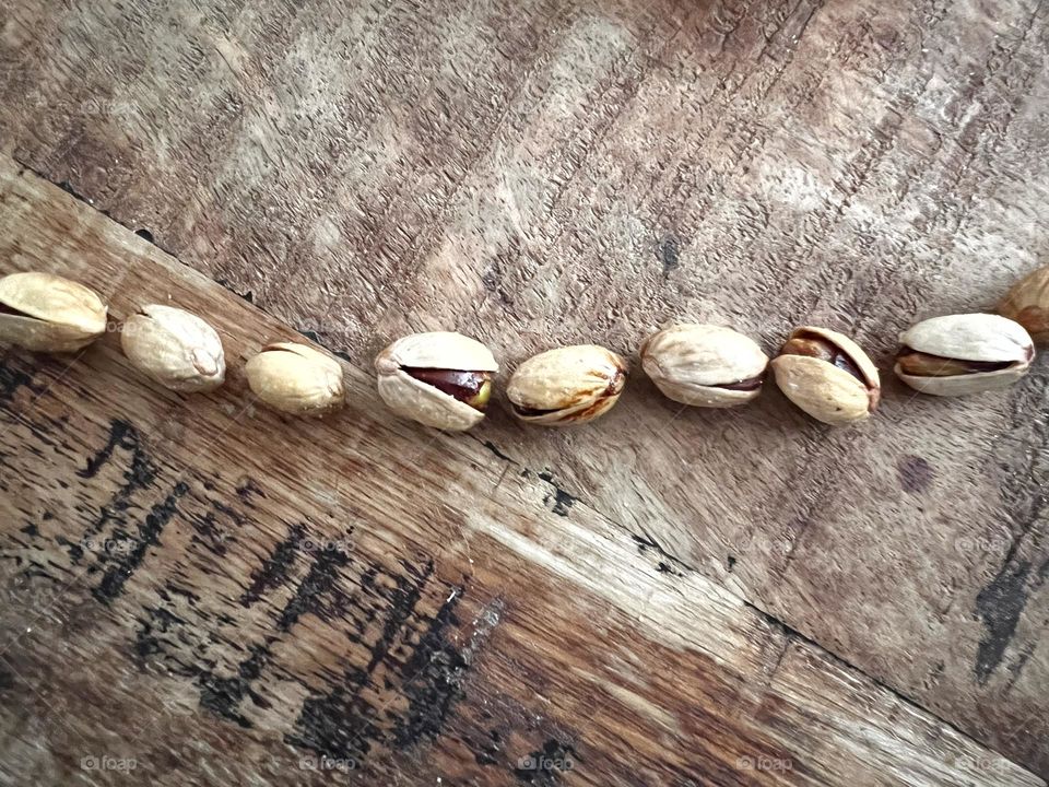 pistachios on a wooden table 