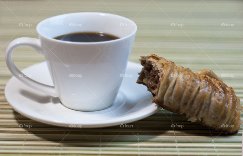 Coffee and cake served on place mat