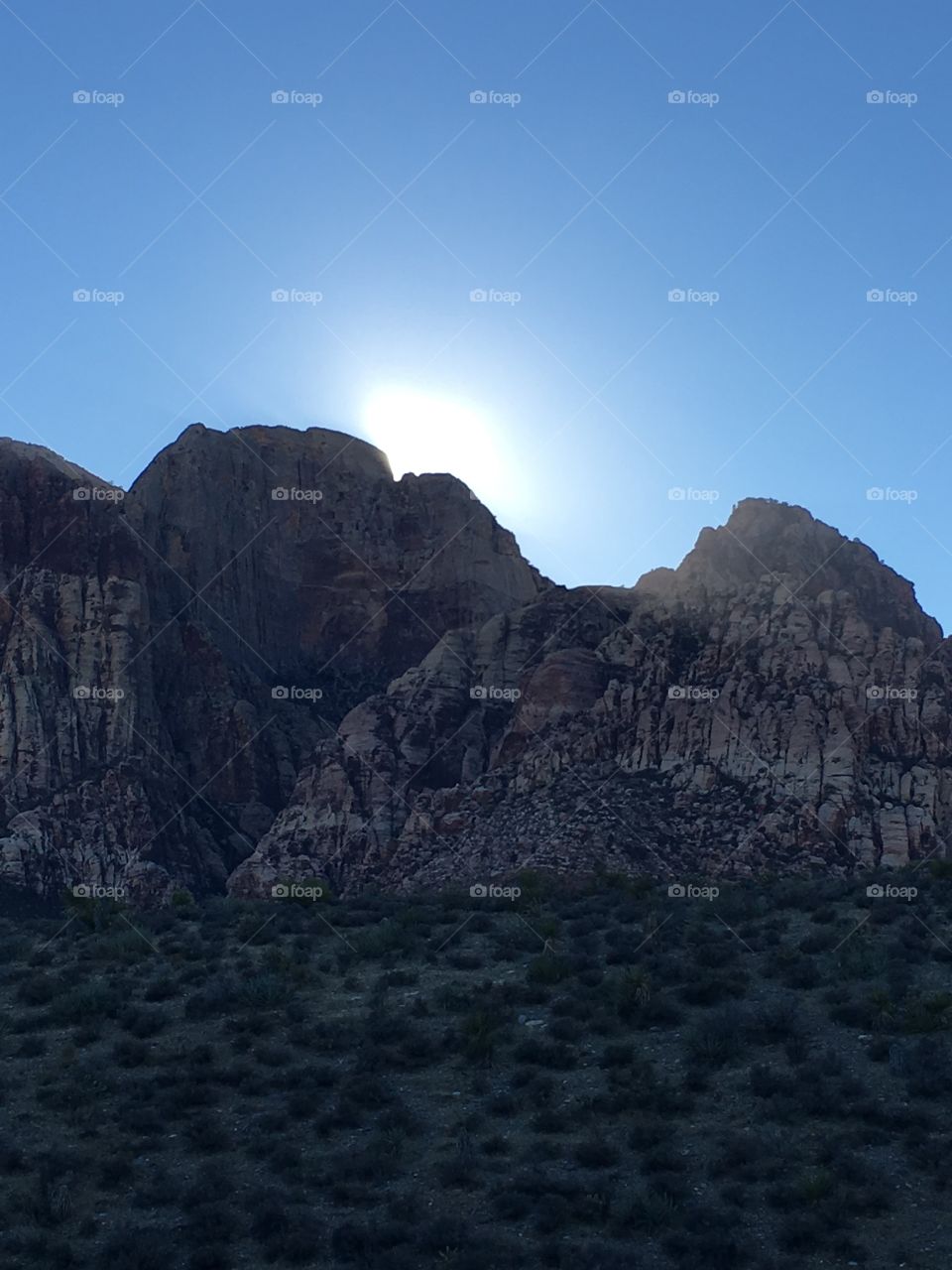 Sun peaking over canyon 