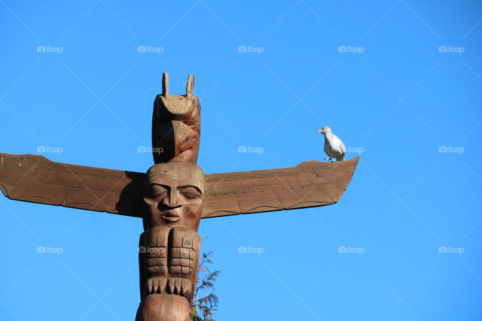 Totem on a blue sky