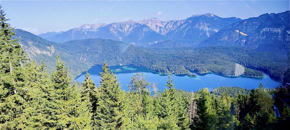 This is the lovely view from the “Zugspitze”, the highest peak of the “Wetterstein Mountains” and at 2962 meters Germany’s tallest mountain in the “Alps”. The highest peaks are glaciers, always covered in ice and snow. 2024. Hypnotic Productions