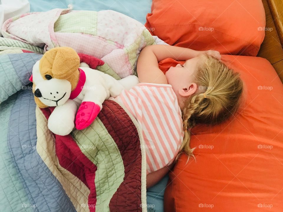 Sleeping toddler with stuffed animal 