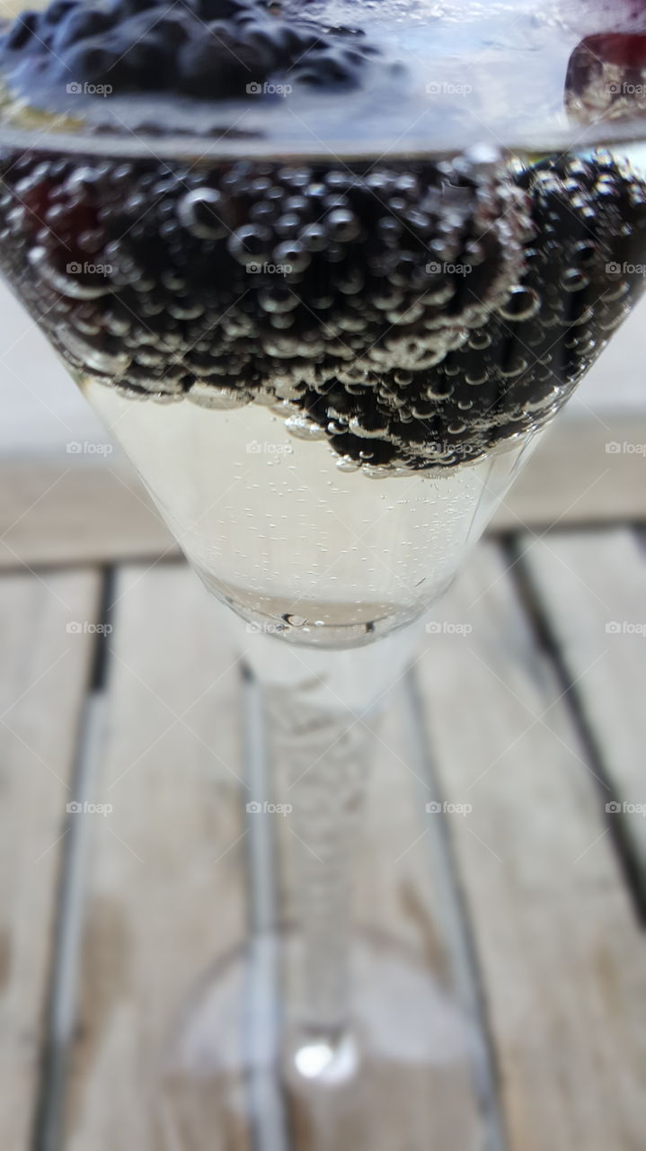 Champagne bubbles and blackberries