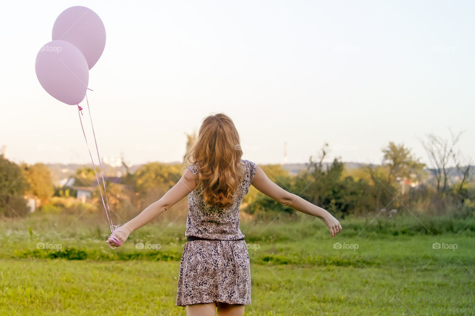 Young millennial woman enjoying June in nature. Birthday girl.