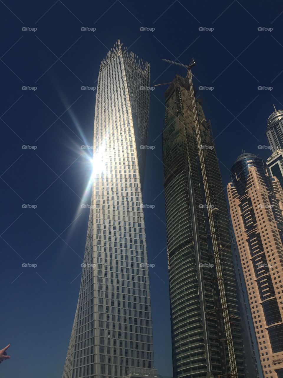 Cayan tower with sun rays