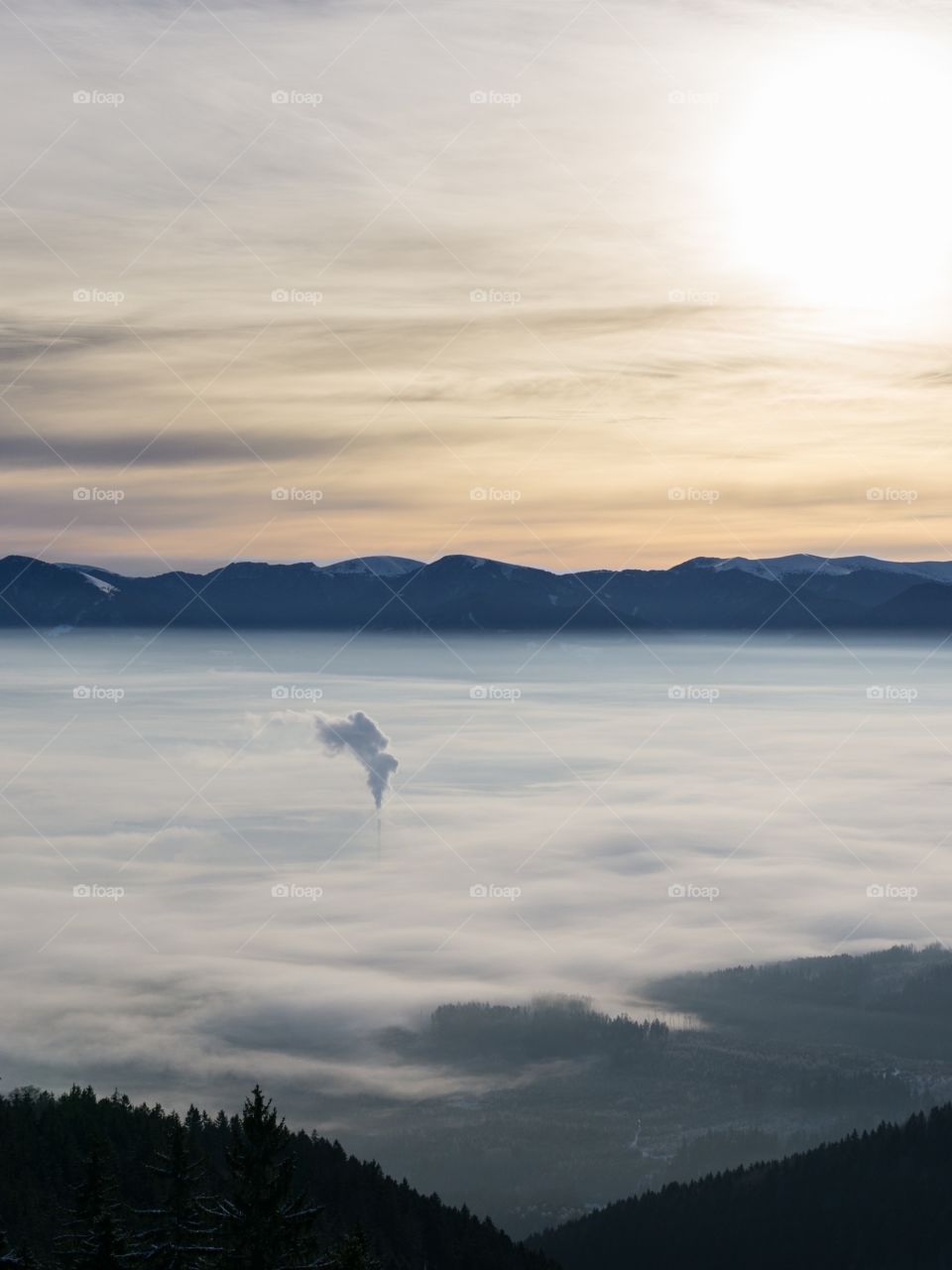 Sunrise, Chimney under the inversion, clouds and mountains