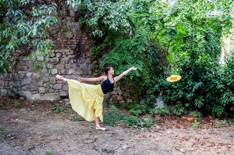 Young Female Ballerina Dancing Outside in Nature