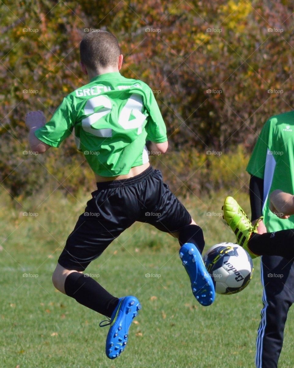 Flying for the soccer ball