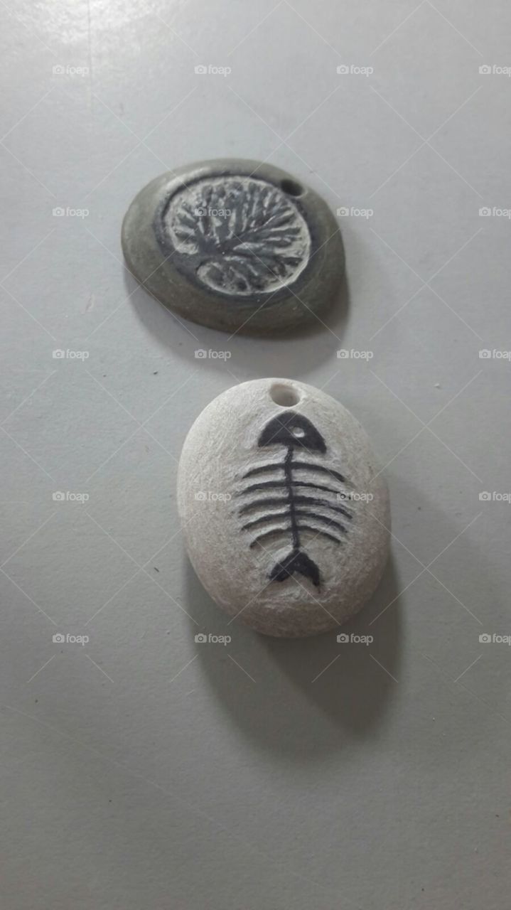Sea stone pendants, carved and ready to be mounted on a necklace.  Handmade by i4elementi.it.  Wearing nature is like living in contact with the universe.  More is less.