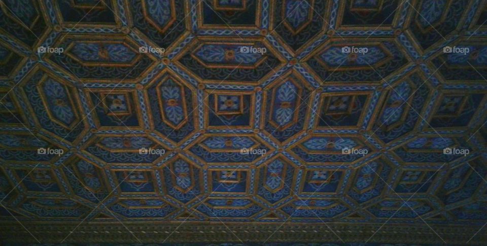 Multiverse -continuing pattern on an ornate, palace ceiling. Blue and gold design.