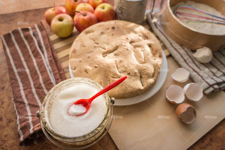 Making homemade puffed apple pie with eggs, sugar and flour.