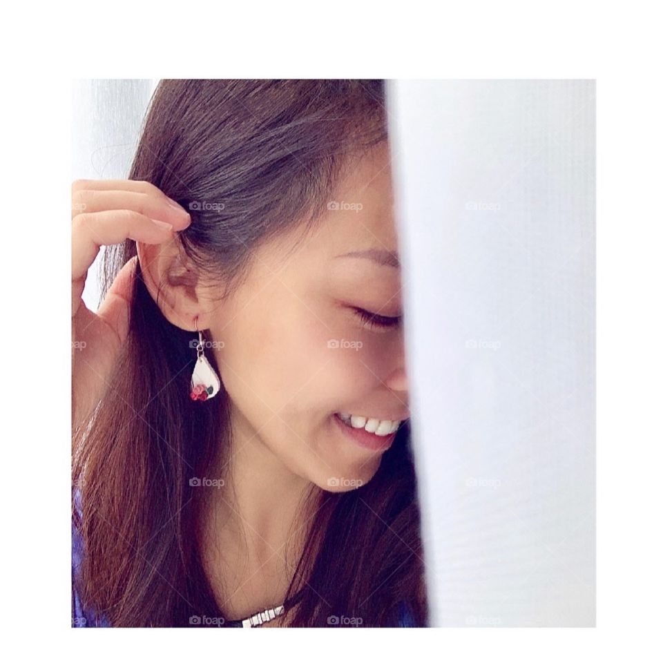 Handmade polymer clay earrings on Asian model 
