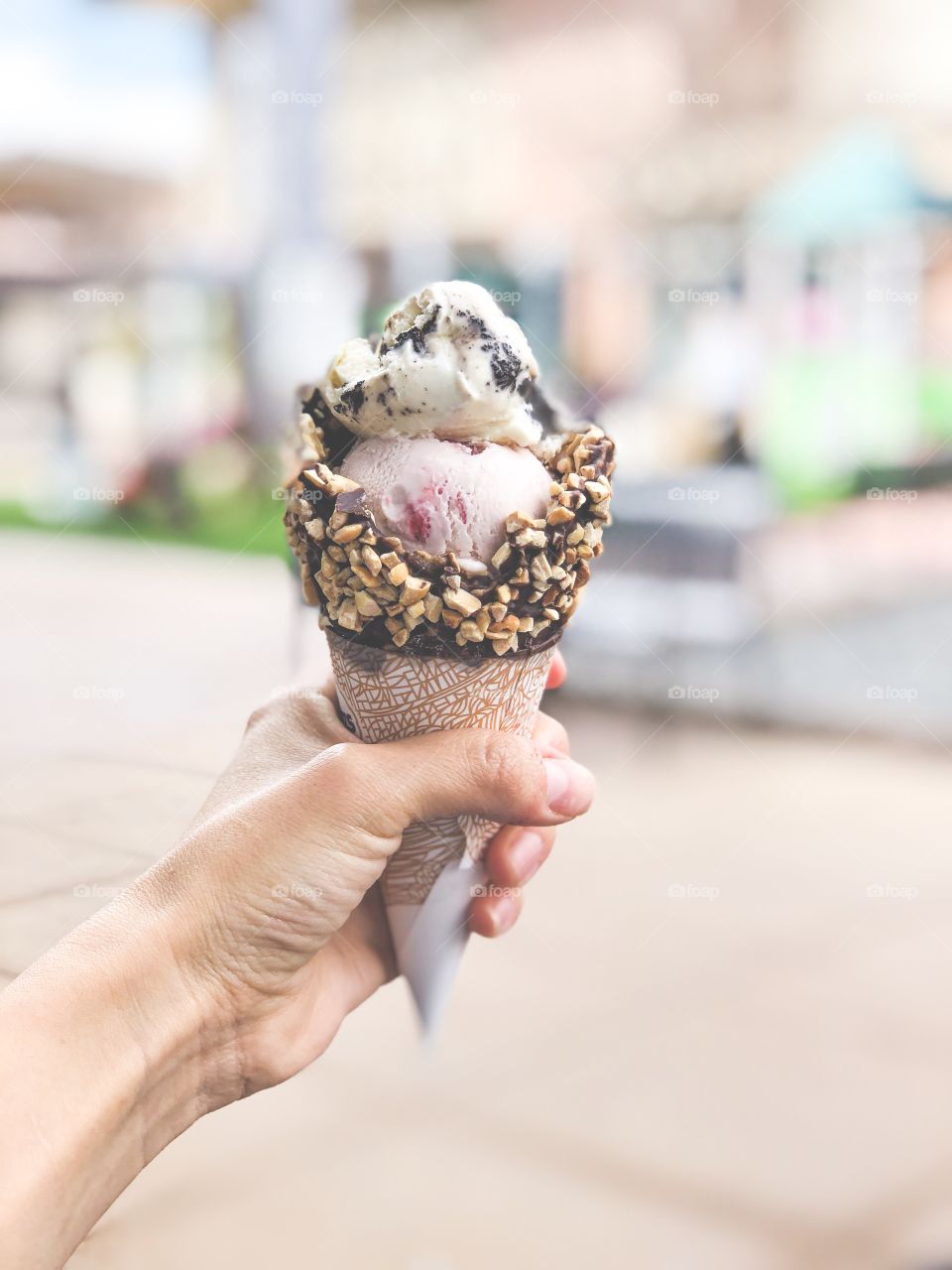 Girl holding ice cream on a sunny summer day 