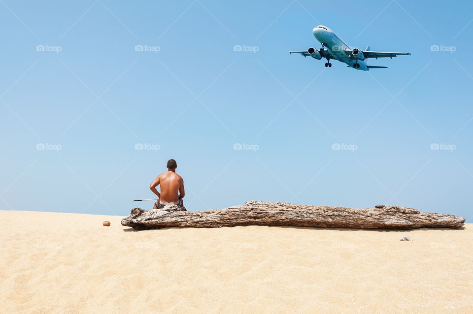 Summer and travel. Unseen Thailand, Some people relax the white sand beach with blue sea and airplane come down to the land