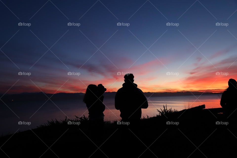 Couple by the ocean on dusk