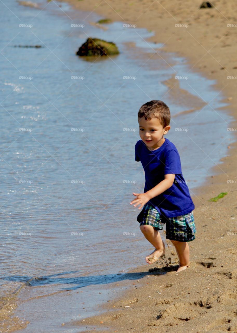 Child running on the beach