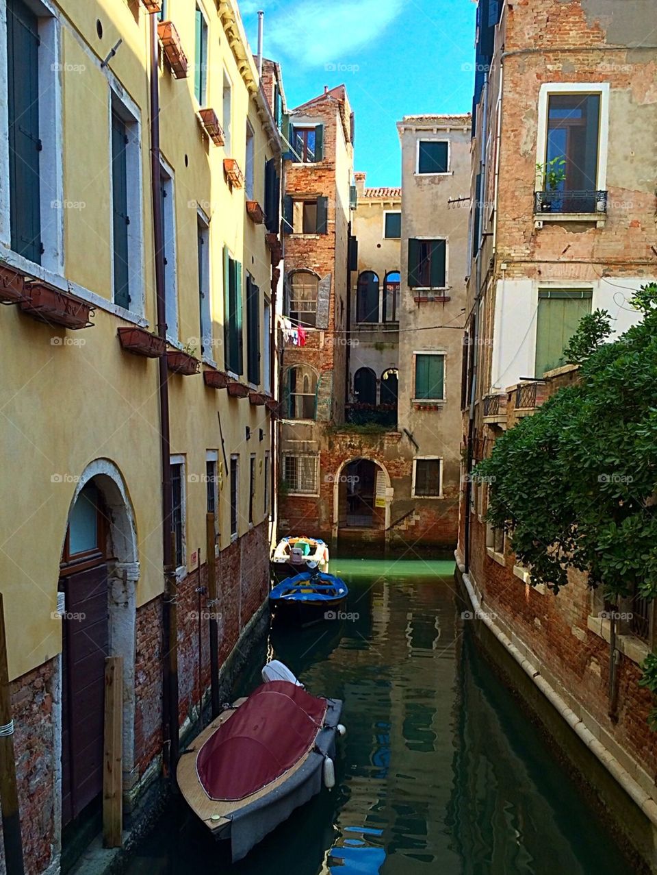 Small canal alleyway in Venice Italy