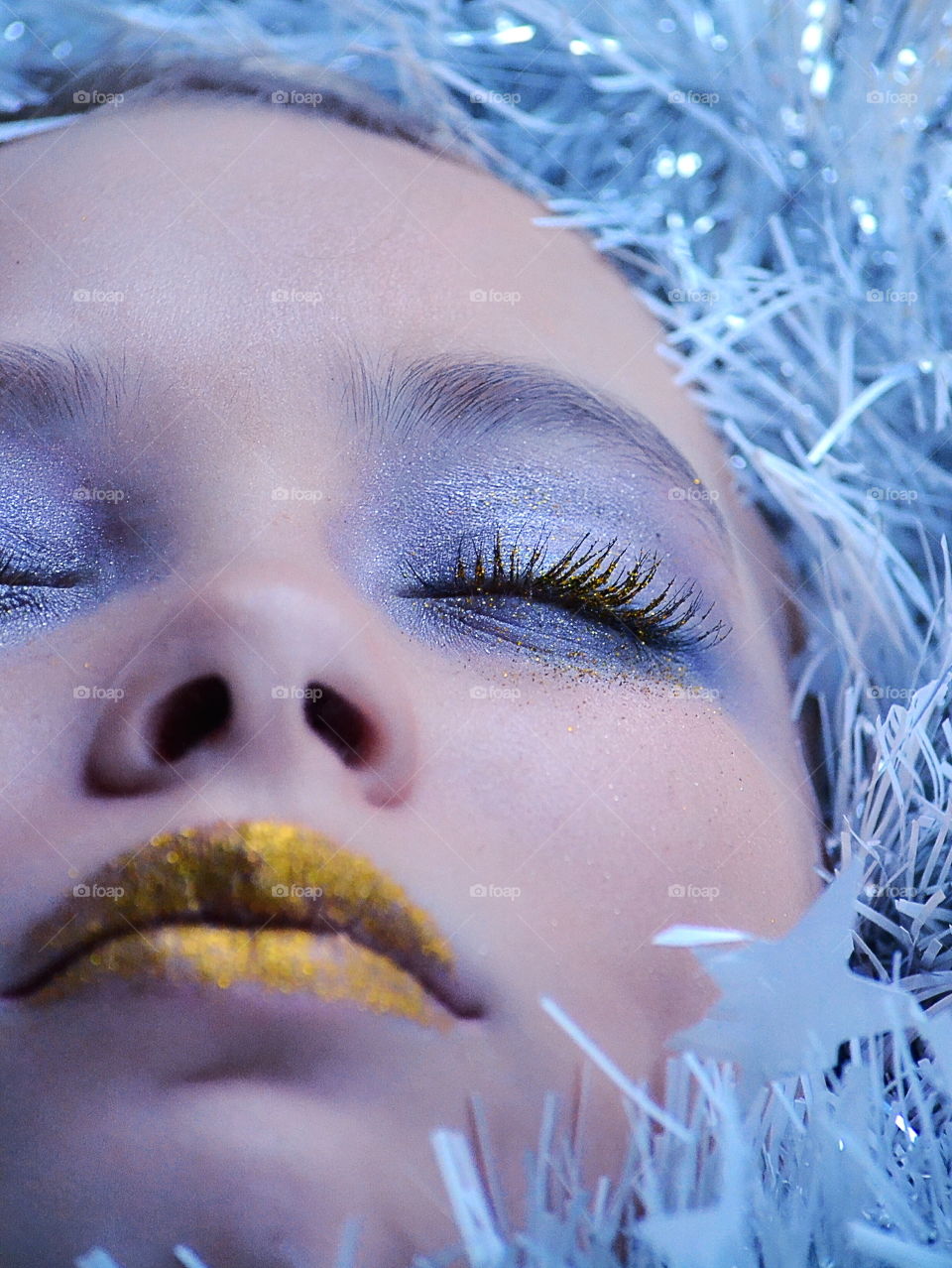 Close-up of a woman with glitter makeup