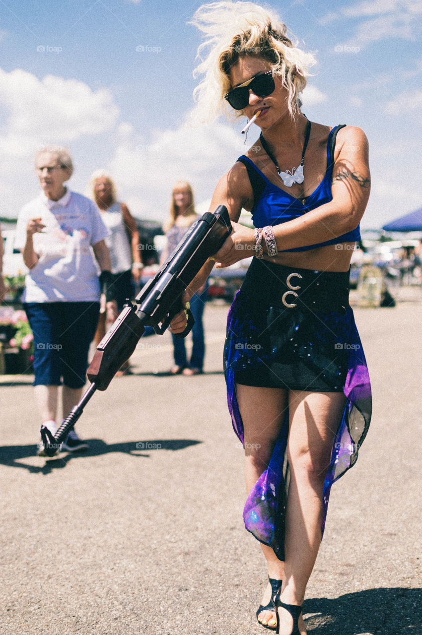 Beautiful woman holding gun