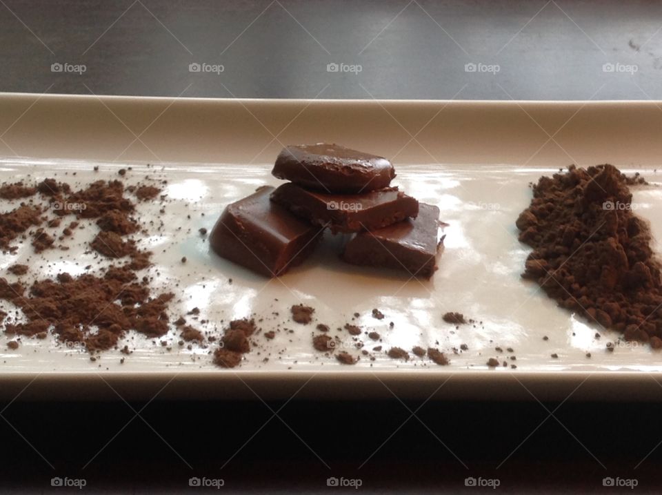 Pieces of fudge with cocoa powder.