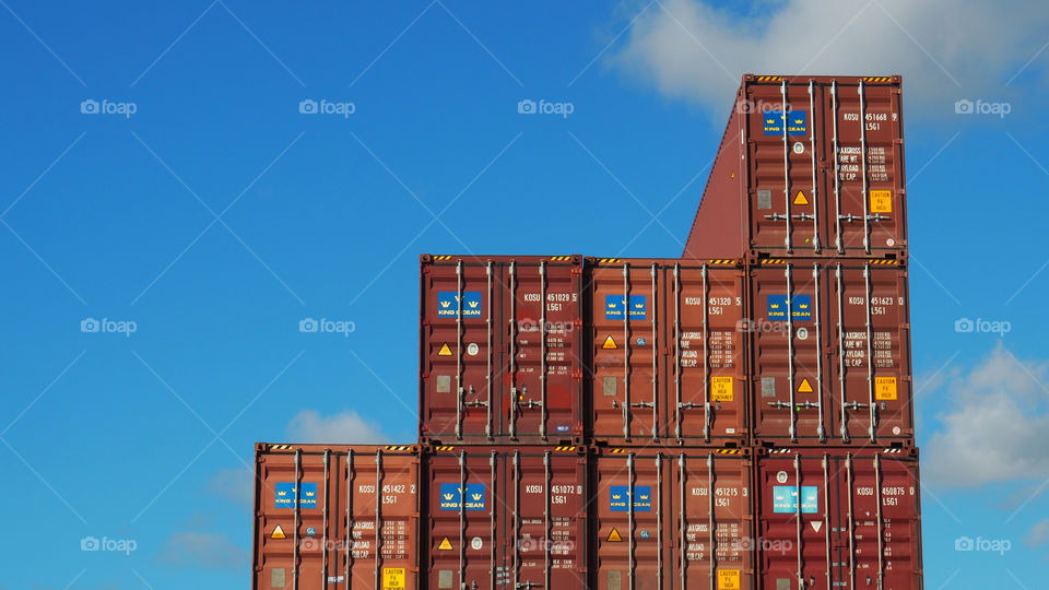 Container cargo ship yard loading exports imports international trade 