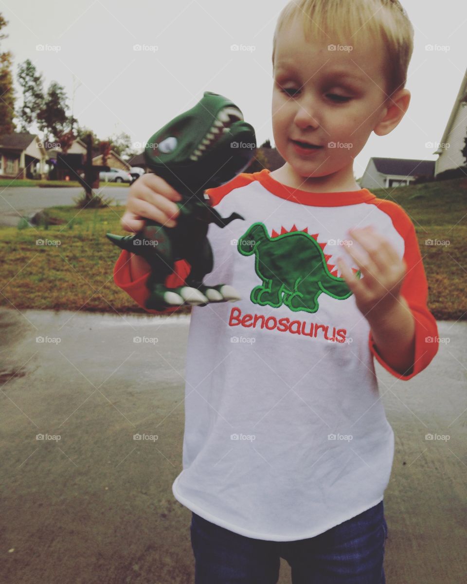 Little man big dinosaur . Birthday boy with love for dinosaurs 