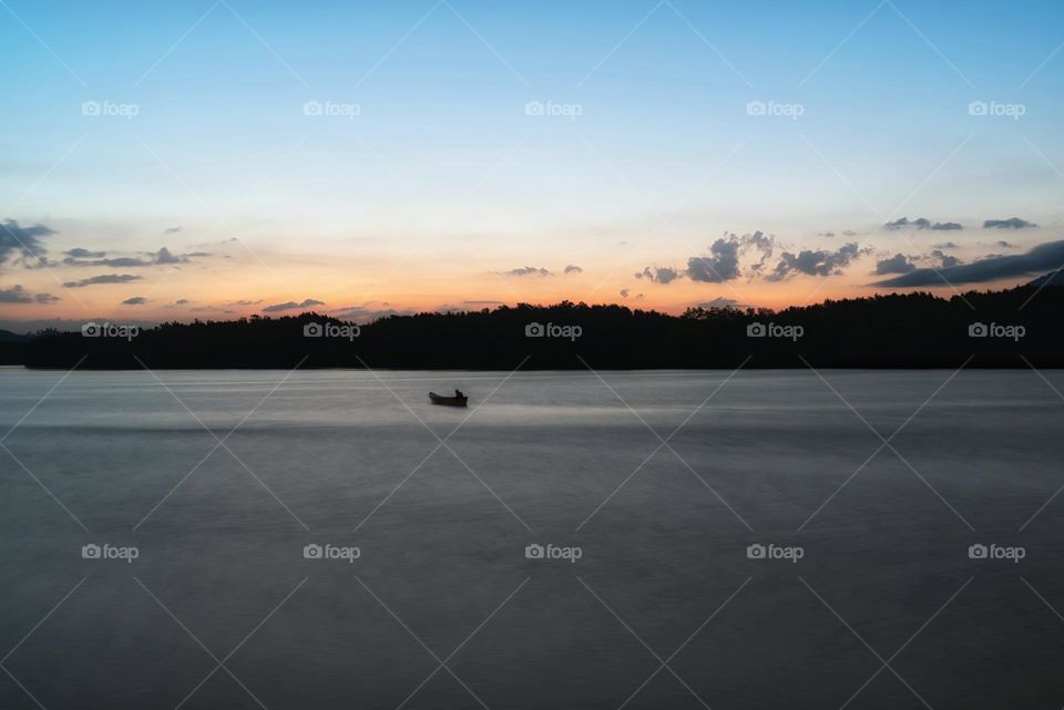 Boat and sea in sunset moment