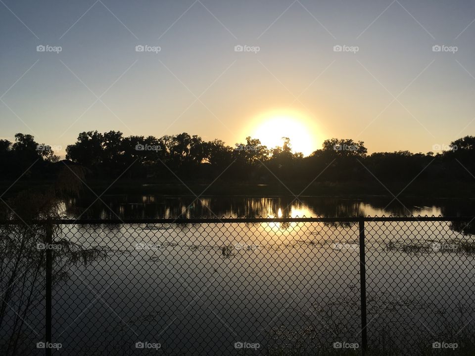 Beautiful sunset over the lake with reflection 