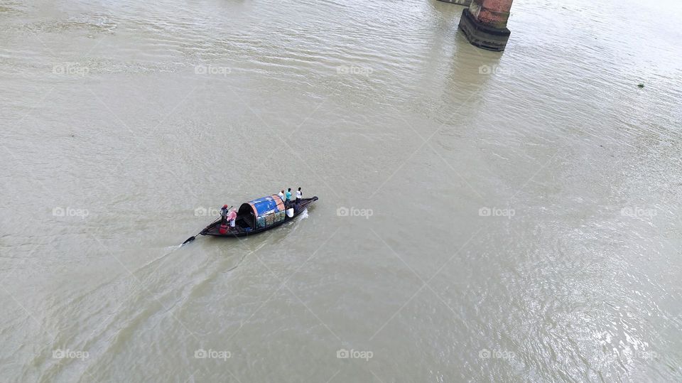 Colourful boat in a river with some people