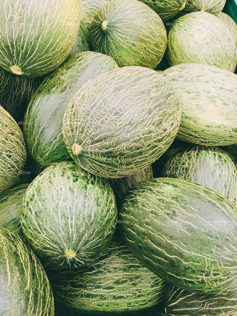 Green melones in the market