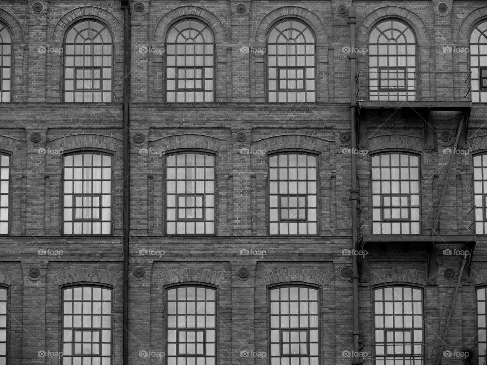 Monochrome photography of the facade of Manufaktura in Łódź, Poland.