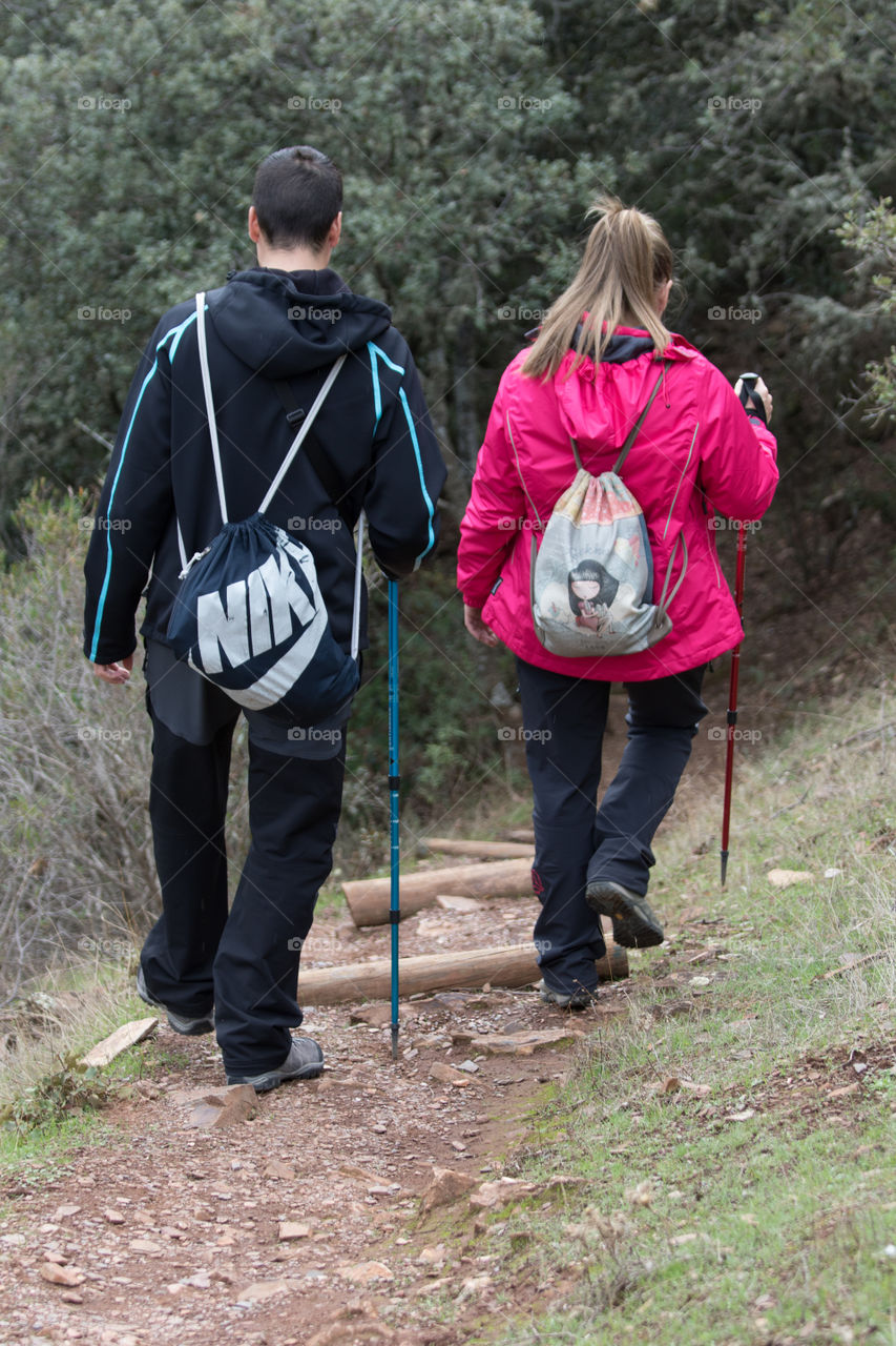 Boy and girl walking down the trail