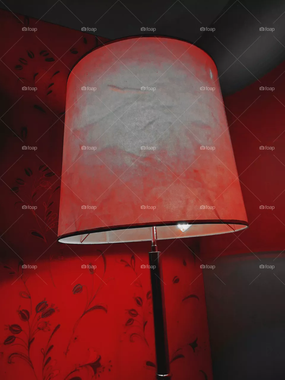 In the red light of her room