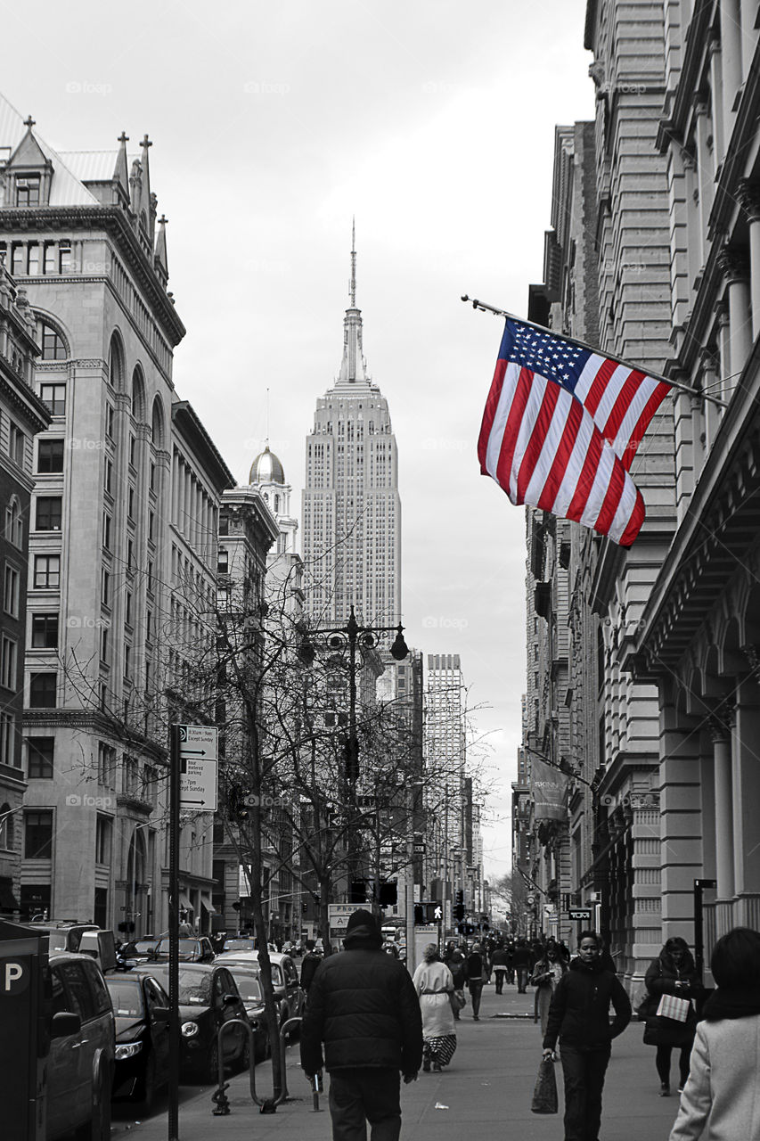 Empire State Building USA. a photo of the Empire State Building black and white with the American flag in color