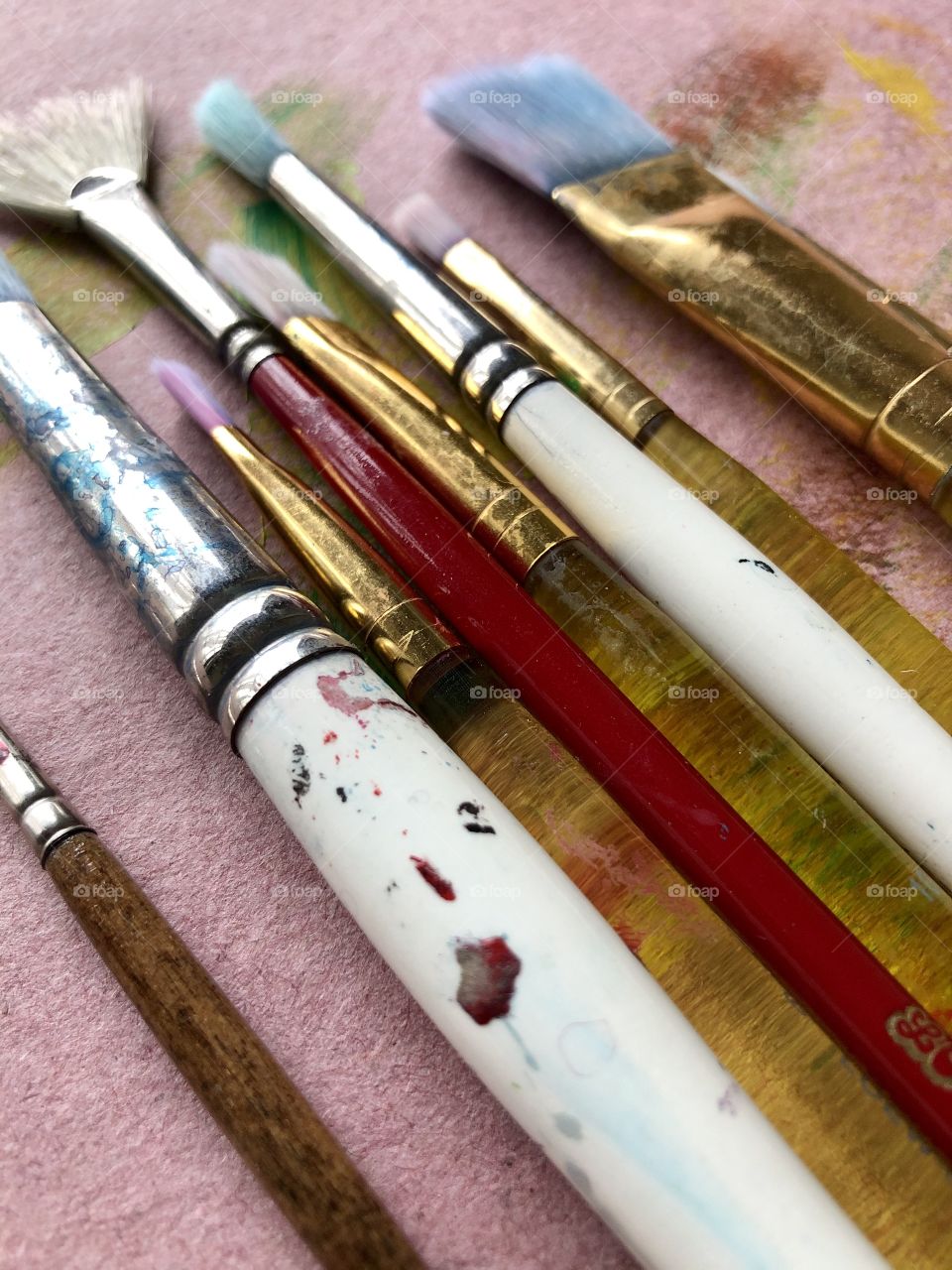 Row of used paintbrushes 