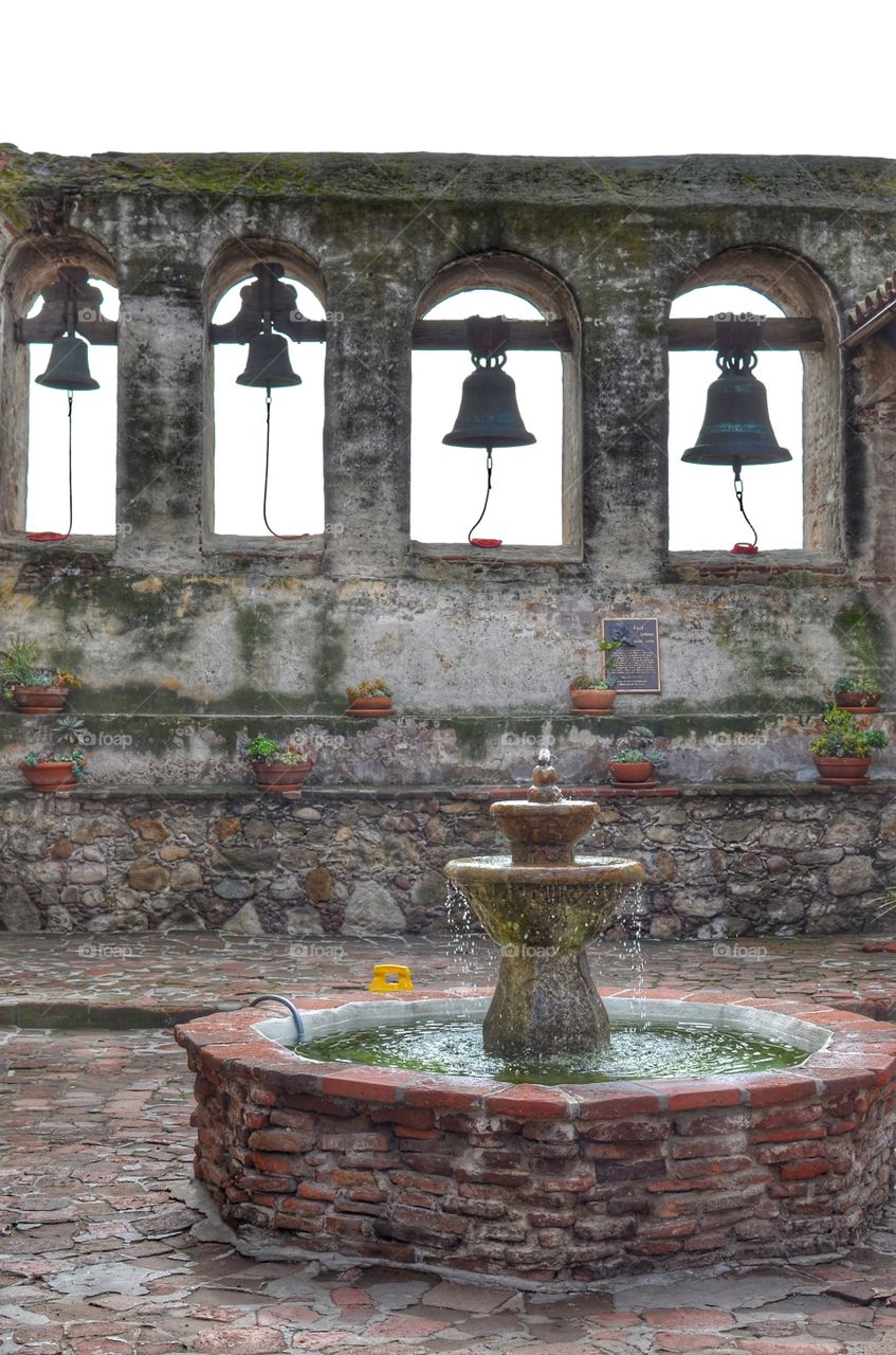 The bells of the mission are happier with the fountain in front of them. 