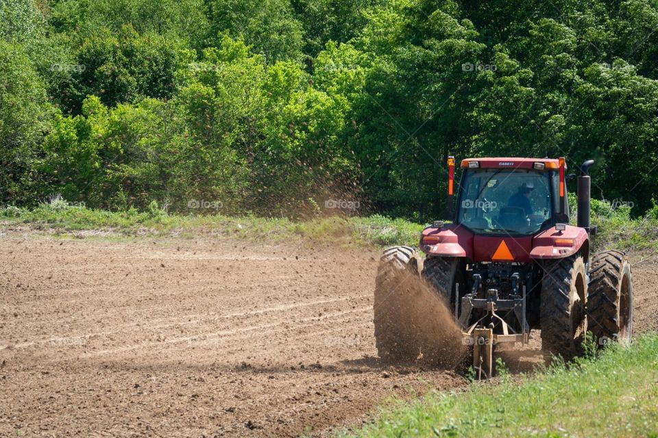 Tractor Spewing Dirt