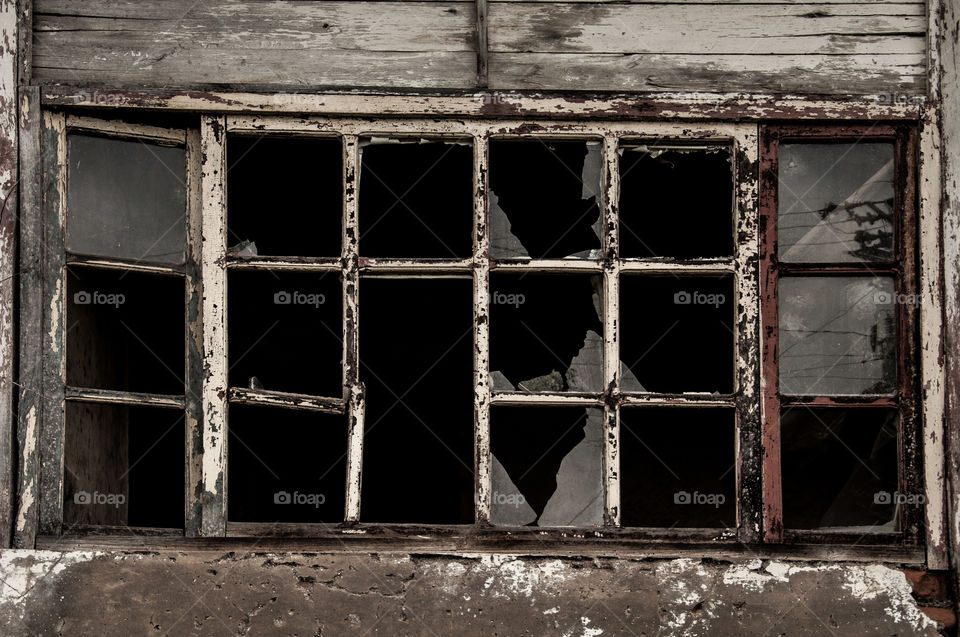 Old window with broken glass