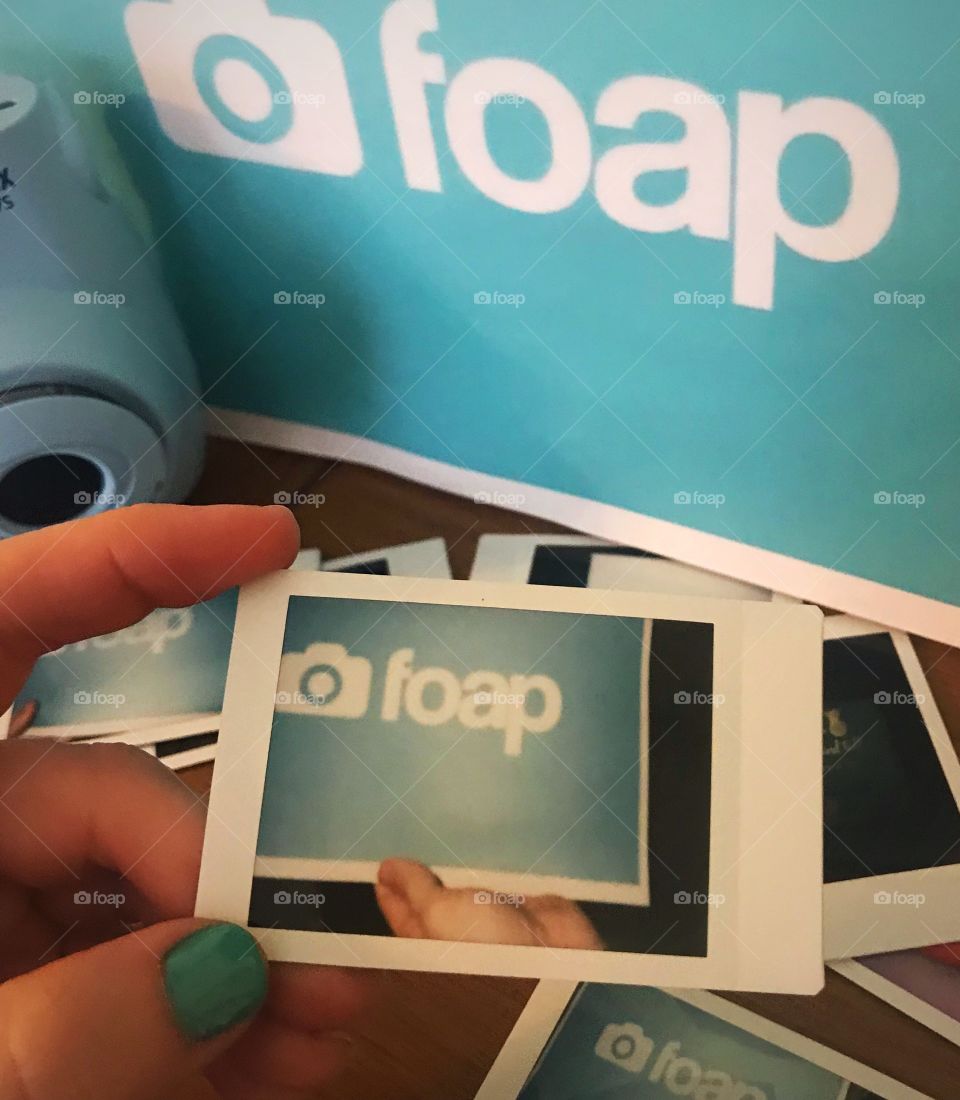 A Polaroid picture capturing the logo of an ingenious photography business. FOAP!