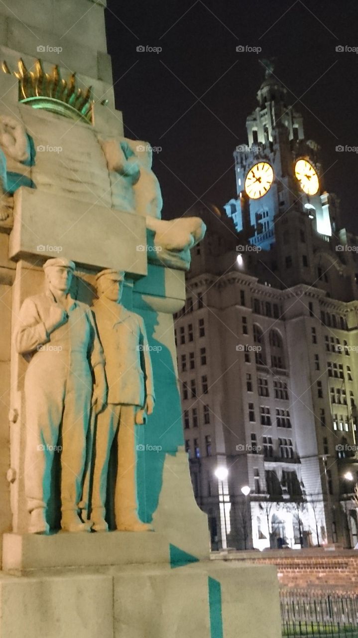 Liverbirds and men. legend has it that if the Liver birds leave Liverpool will car to exist 