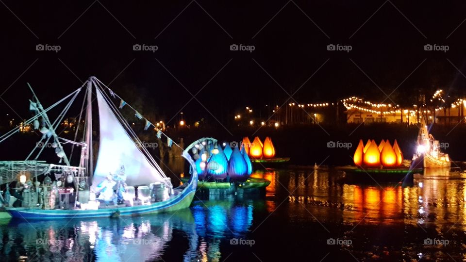 A brilliantly illuminated ship makes its way into Discovery River during Rivers of Light at Animal Kingdom at the Walt Disney World Resort in Orlando, Florida.