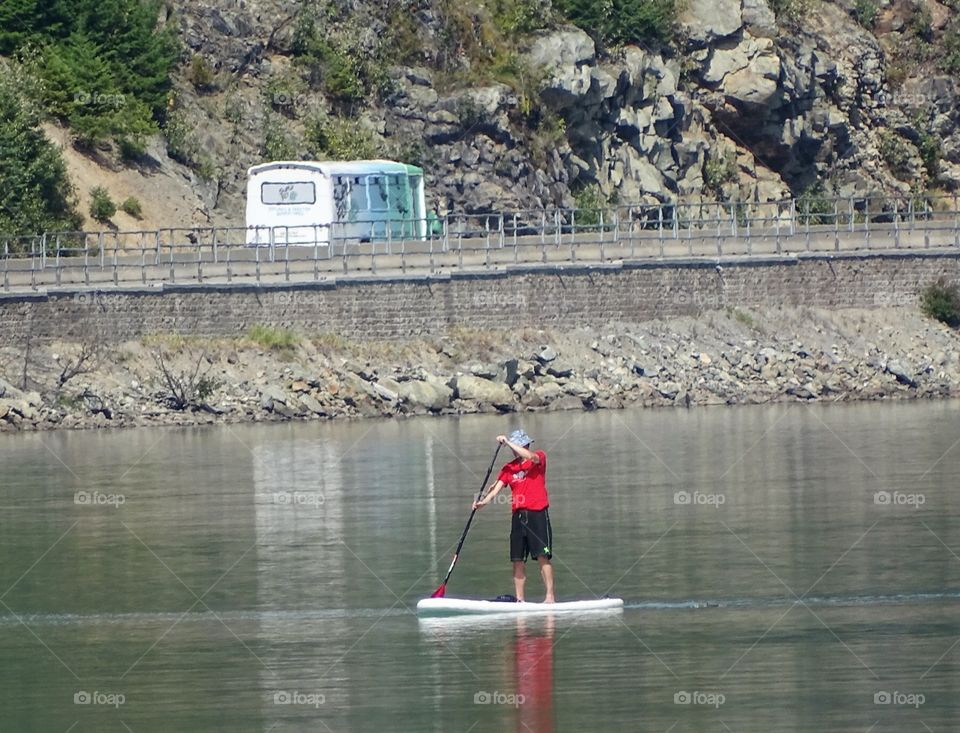 Paddle boarding . Paddle boarding on a lake