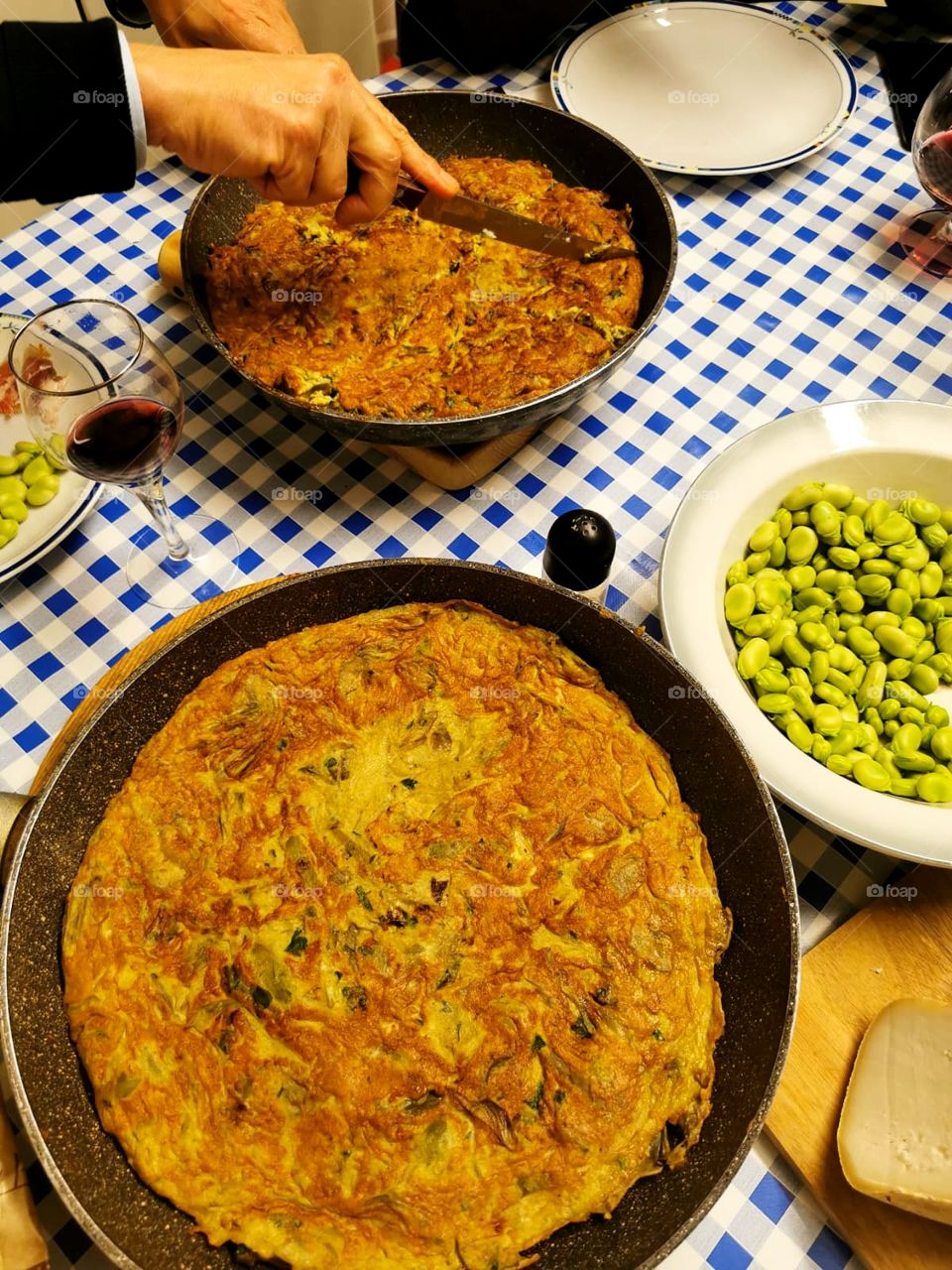 Italian dinner: scrambled eggs, fresh beans and a glass of wine