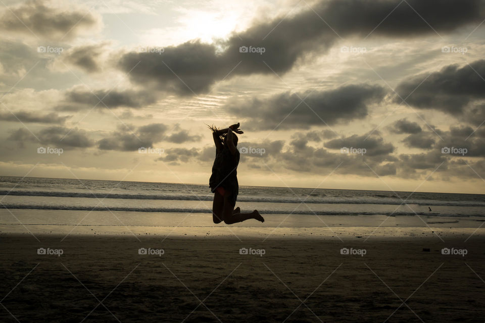 the summer jump on the beach