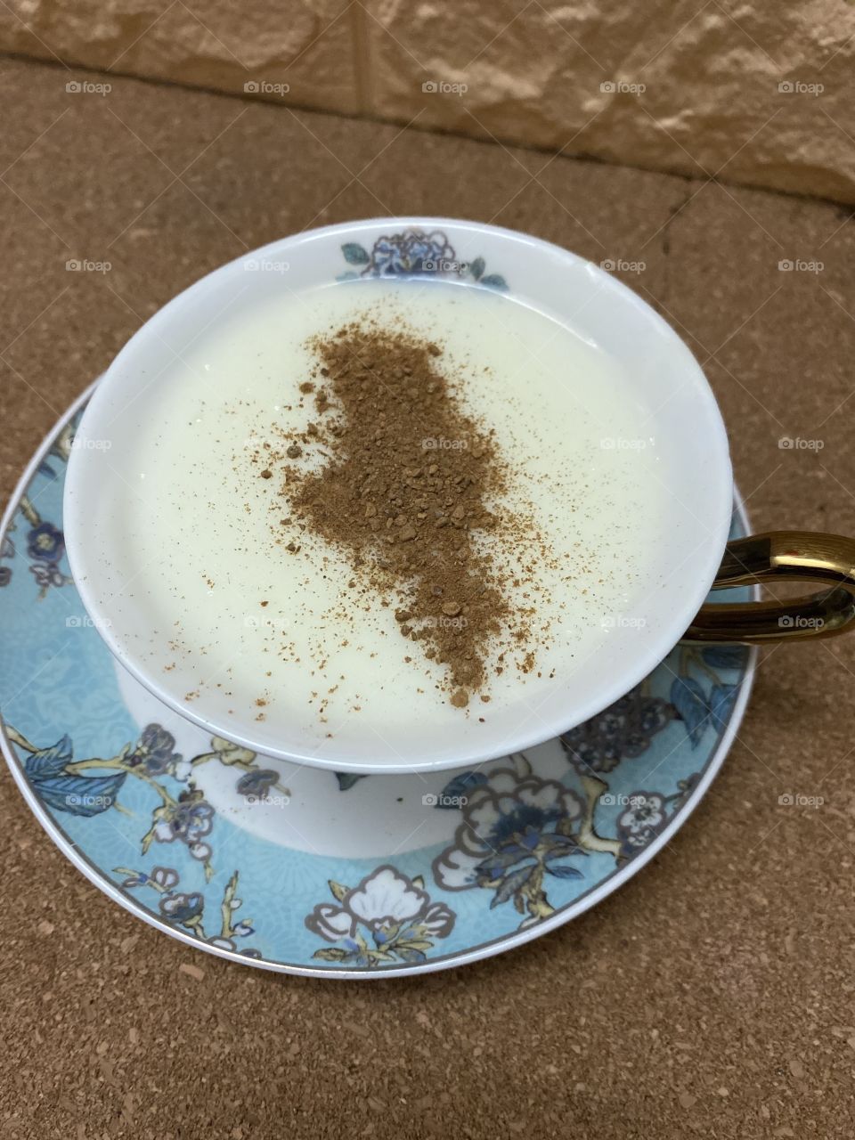 on the plate, sahlab with cinnamon 