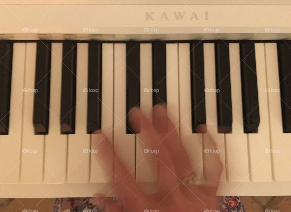 Fingers practicing piano